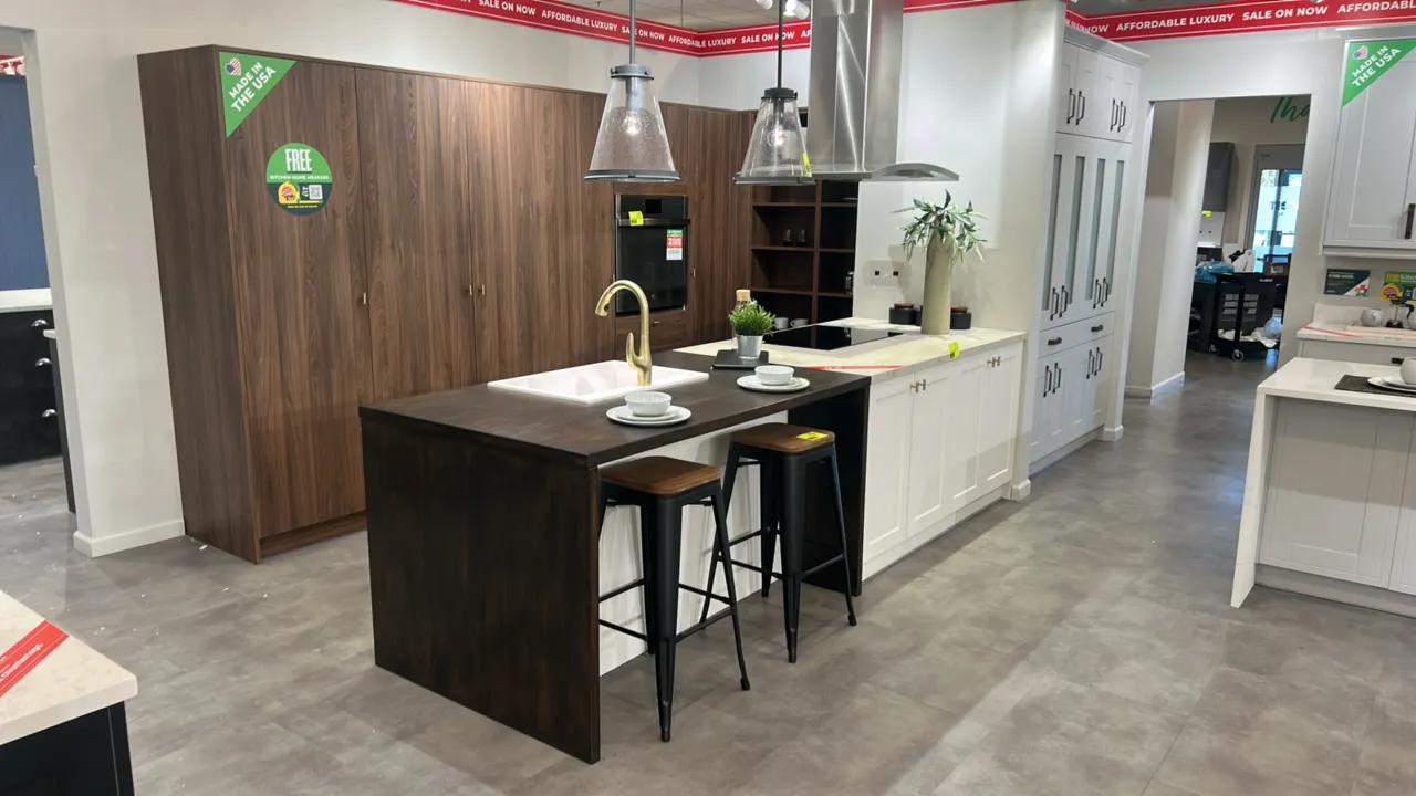 Wren Kitchens Infinity Plus laminate kitchen island cabinets with laminate countertops and Blanco sink. Features white base cabinetry, drawers, dual-f