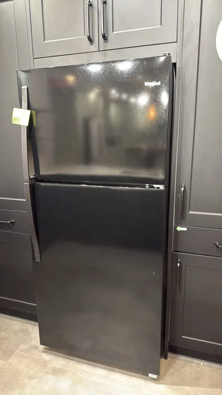 2022 Whirlpool WRT318FZDB09 top-freezer refrigerator. Features black finish, adjustable glass shelves, dual crisper drawers, and in-door storage bins.