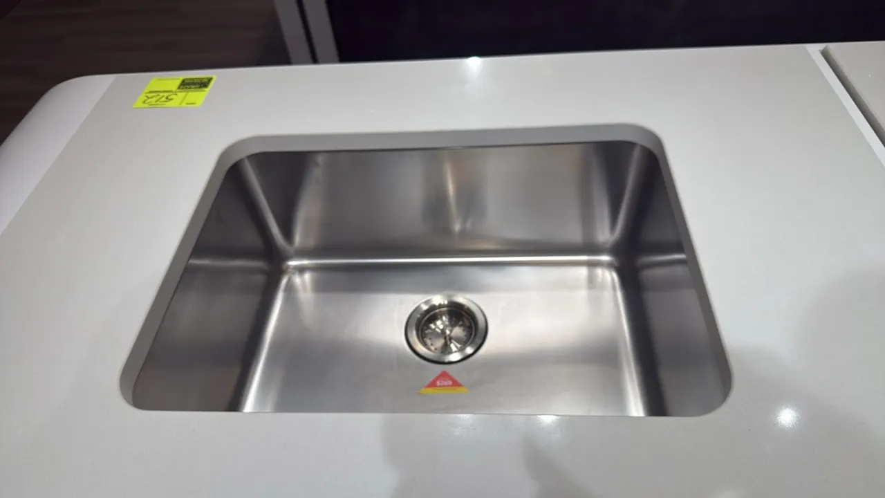 Stainless steel single-bowl dual mount sink. Features dual-mount design and center drain with removable basket strainer. Dimensions: 24"W. Note: Count