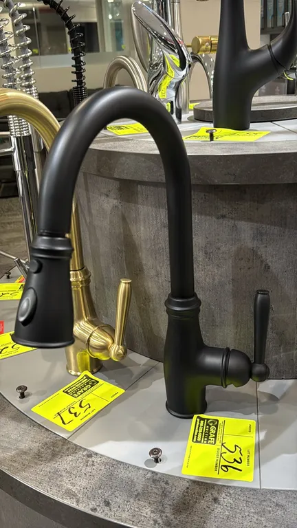 Bocchi pull-down faucet. Features matte black finish, single lever handle, high-arc gooseneck spout, and pull-down spray head with toggle control. Dis