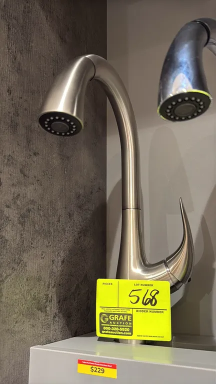 Yukon FA.SAN.01.001 pull-down kitchen faucet. Features stainless steel finish, single-lever handle, high-arc gooseneck spout, and pull-down spray wand