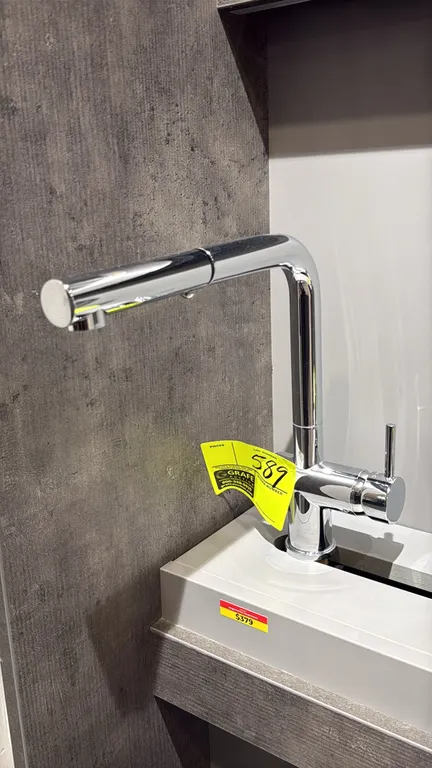 Ganges FA.PAL01.004 pull-out kitchen faucet. Features a polished chrome finish, single-lever control, and pull-out spout. Note: Display base and surro