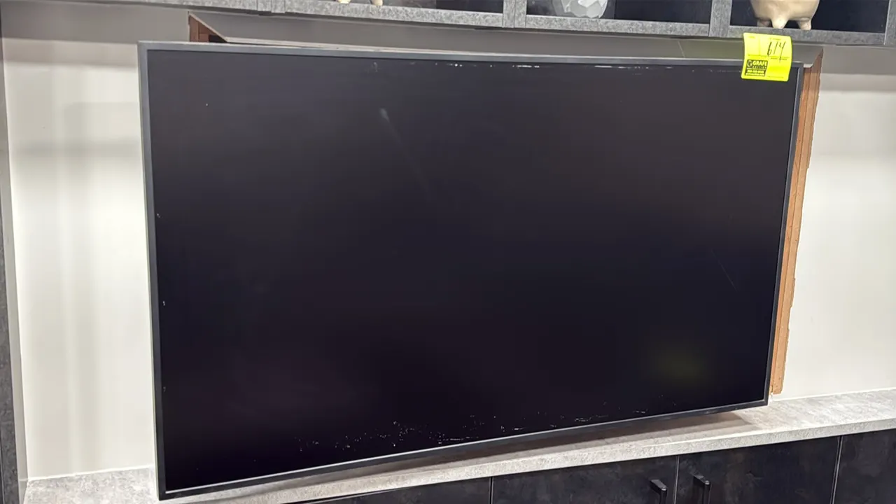 2021 Samsung QM50R-A 50" flat screen color display monitor. S/N: 0CHUHCRRA03152W. Electrical: 100-240V, 50/60 Hz, 155W. Includes articulating wall mou