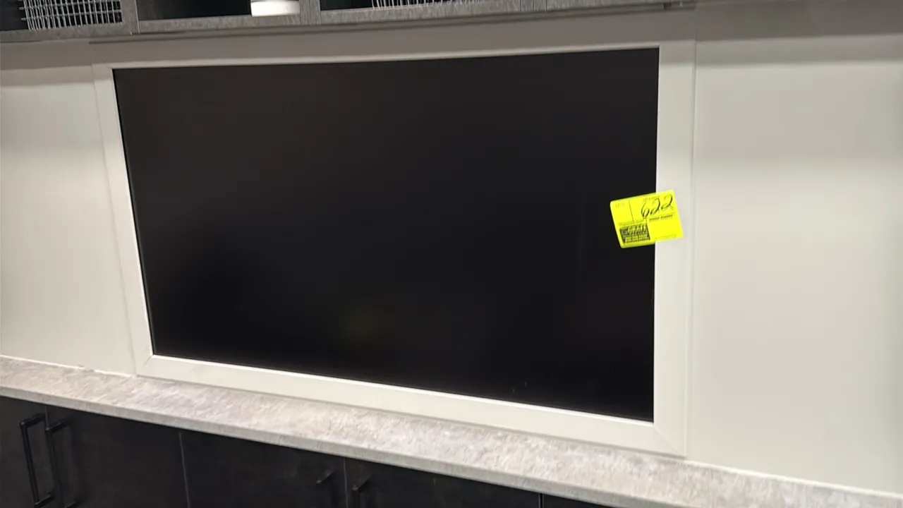 Samsung 50" flat screen monitor. Includes wall mount bracket. Surrounding cabinetry and counter not included.