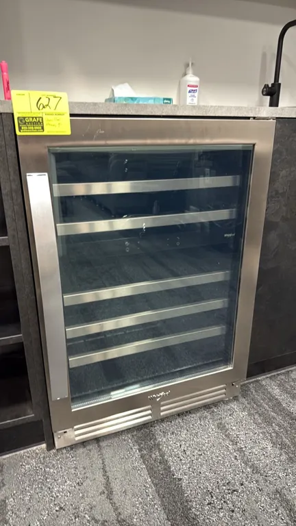 Whirlpool WUW55X24HS01 self-contained undercounter wine cooler. Features a stainless steel framed glass door, slide-out racks, and digital touch contr