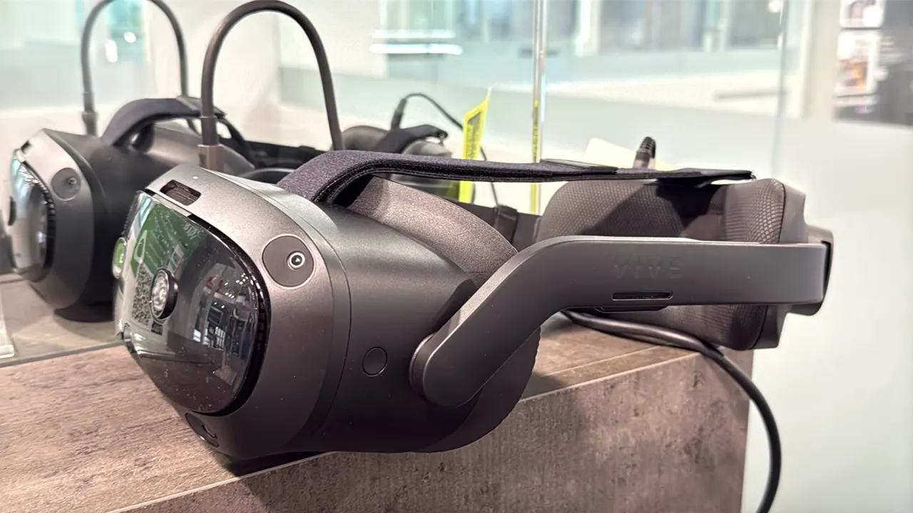 HTC VIVE Focus Vision virtual reality headset. Features front tracking cameras, adjustable rigid head strap with top strap, cushioned face gasket, rea