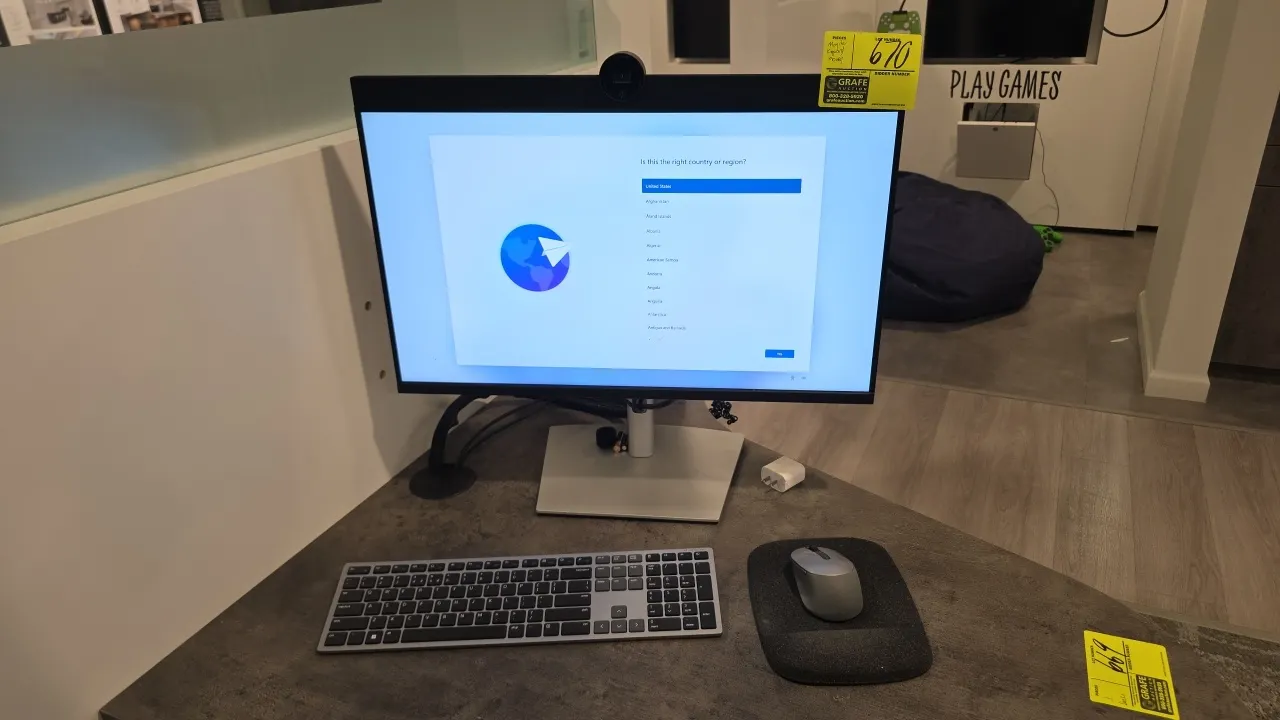 Dell 24" flat panel monitor. Features integrated pop-up webcam, DisplayPort and HDMI connectivity, and adjustable desk stand. Includes wireless keyboa