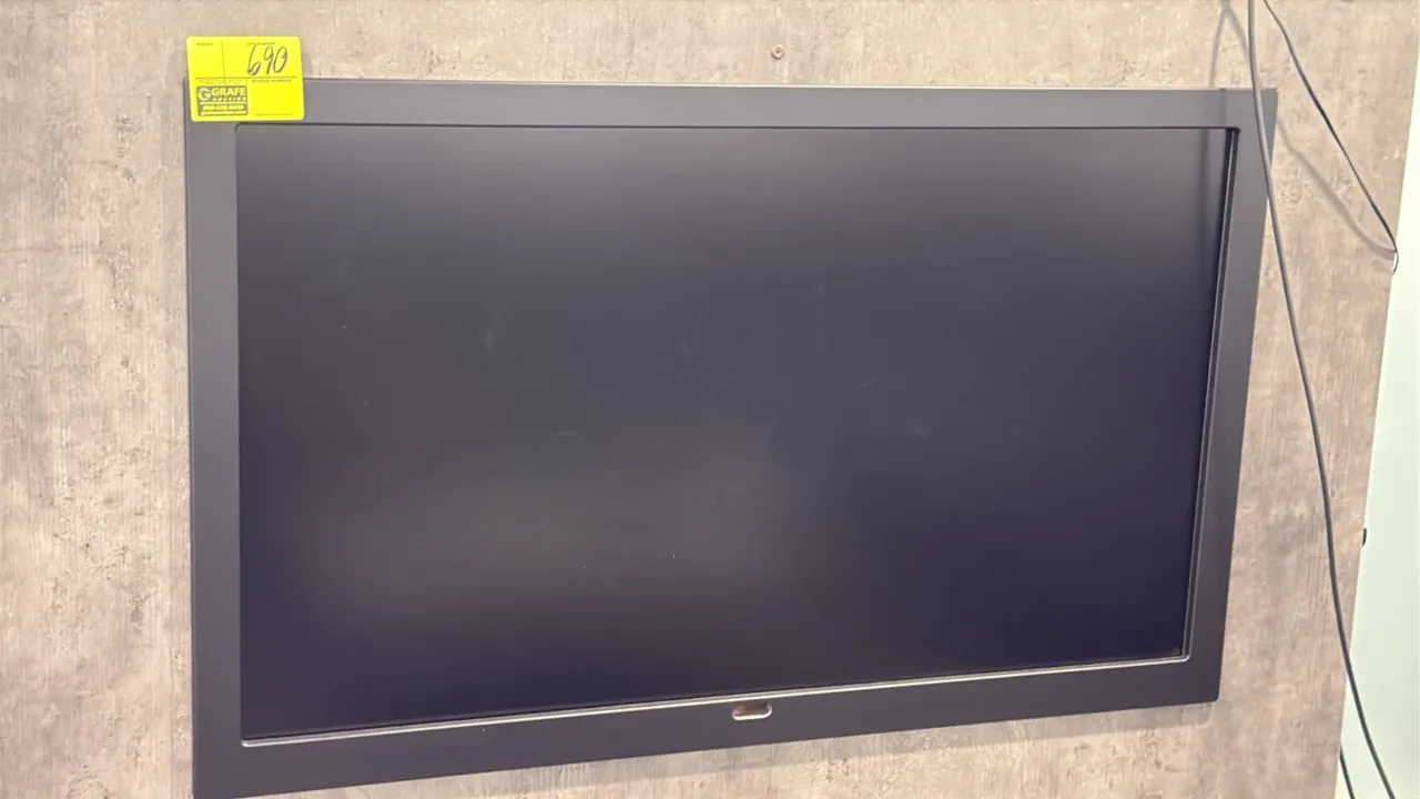Samsung 50" flat screen color display monitor. Features a black bezel finish. Wall-mounted.