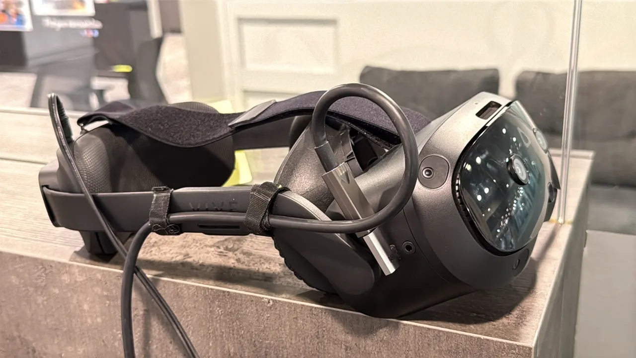 HTC VIVE Focus Vision virtual reality headset. Features integrated front tracking cameras, adjustable head strap with rear adjustment dial, top strap,