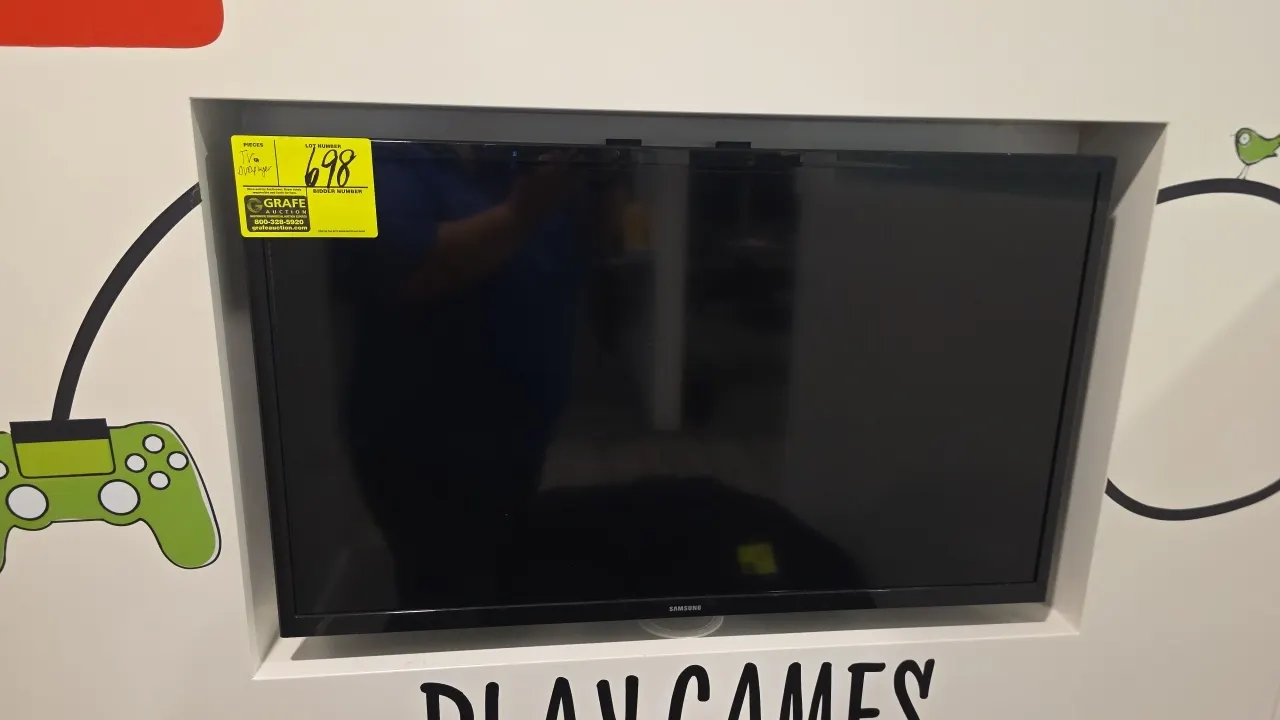 Samsung 32" flat screen TV with Sony DVP-SR510H CD/DVD player. Includes wall mount bracket. Sony unit manufactured July 2021, S/N: 6752731. Electrical