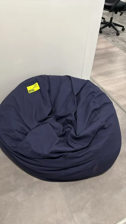 Bean bag chairs. Features dark blue fabric covers.
