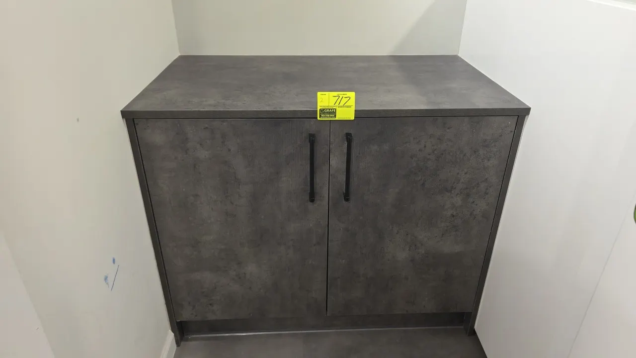 Laminate storage cabinets. Features textured gray finish, double doors with black handles, and interior shelving. 45"W. Contents not included.