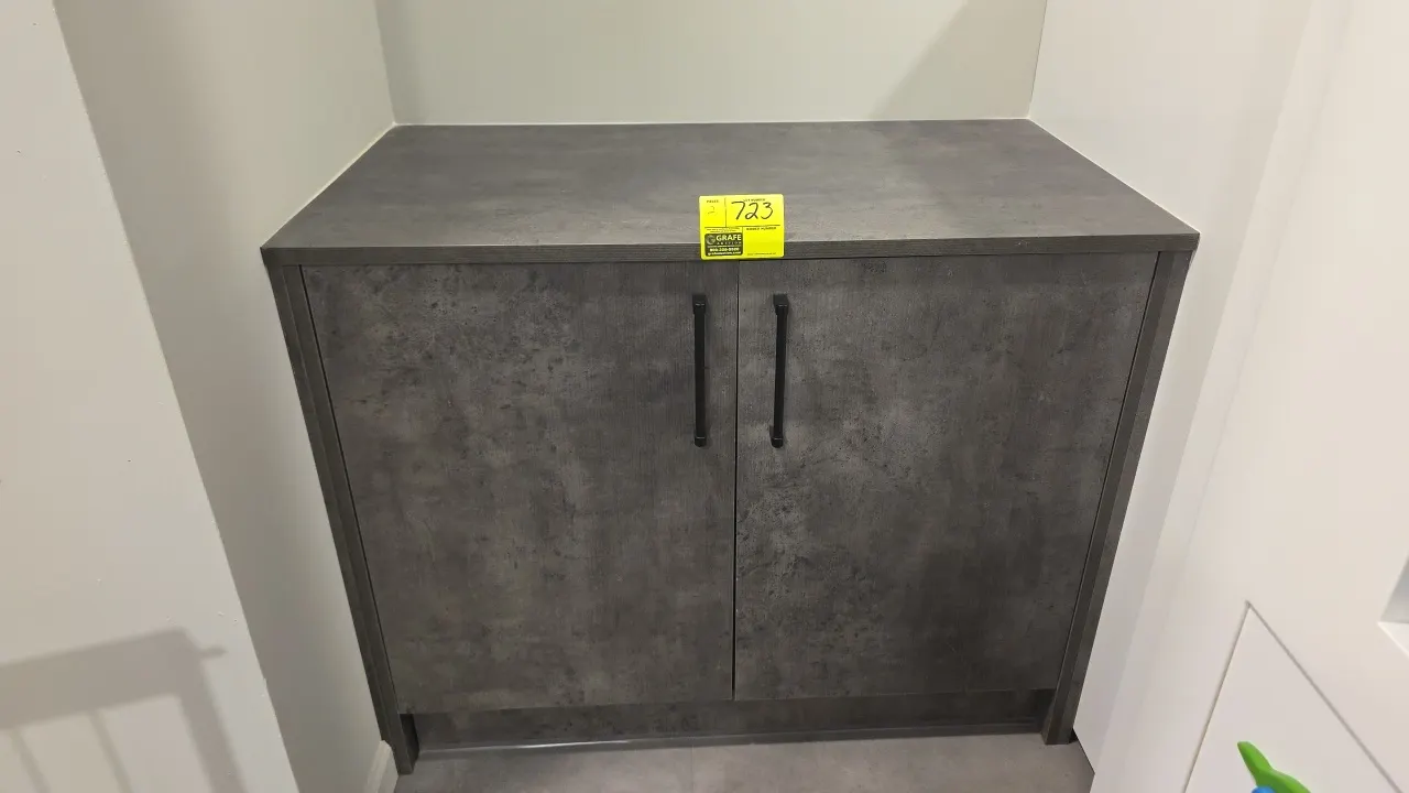 Laminate double-door storage cabinets. Features dual hinged doors with black pulls, center divider, interior storage shelving, and gray textured lamin
