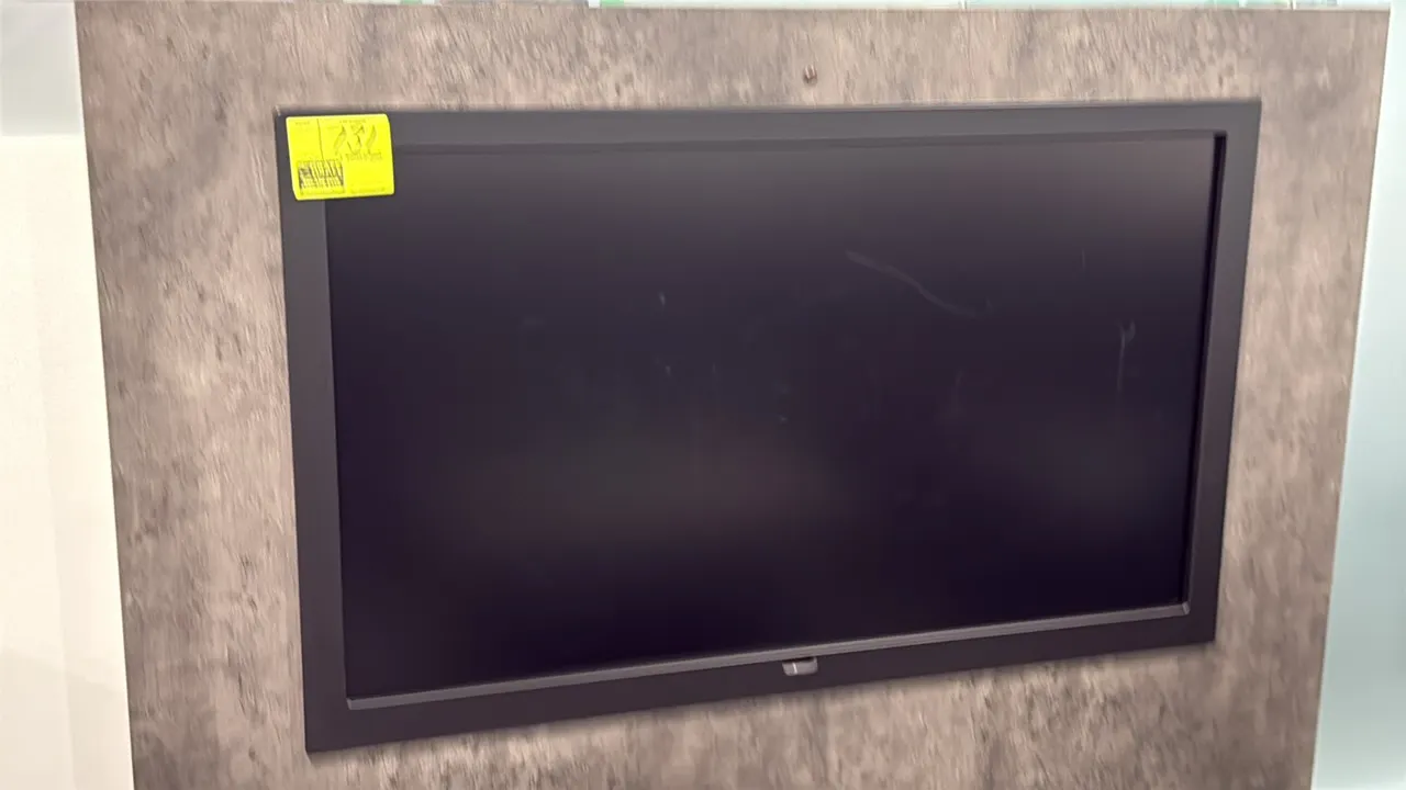 Samsung 50" flat screen color display monitor. Features a black bezel. Wall mount panel not included.