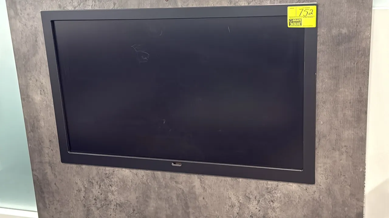 Samsung 50" flat screen color display monitor. Features a black bezel frame. Wall panel and surroundings not included.