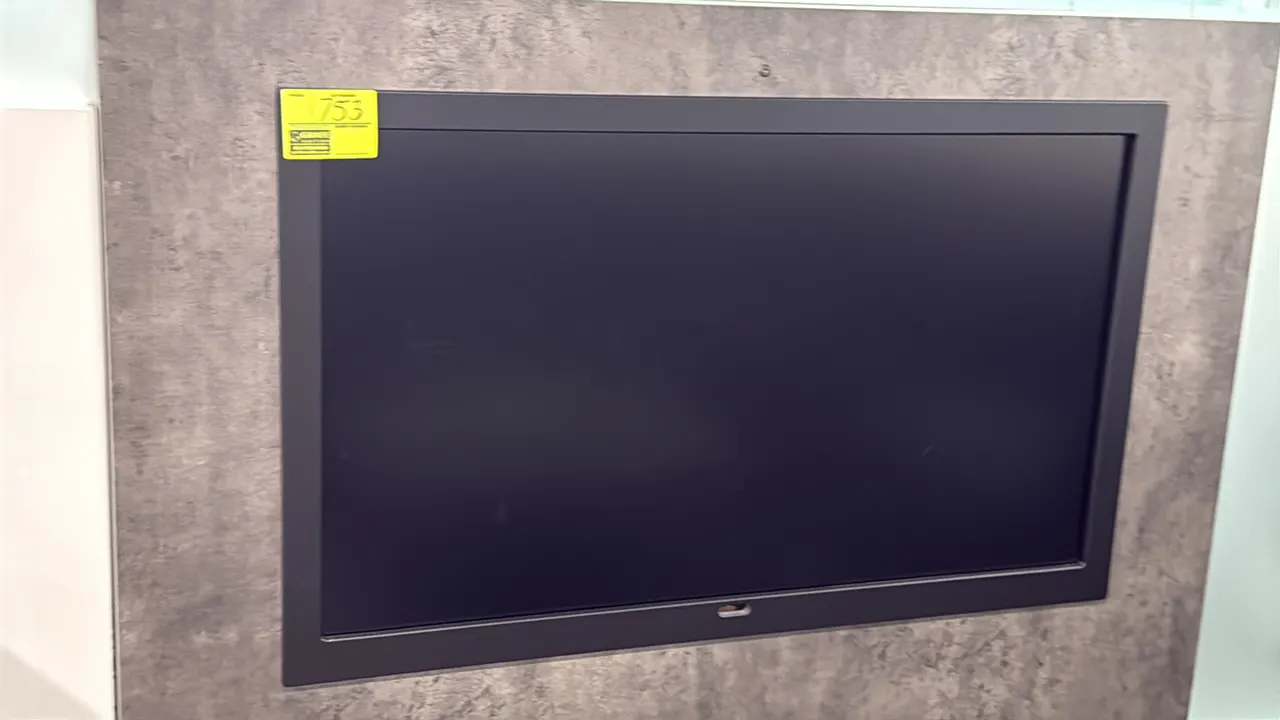 Samsung 50" flat screen color display monitor. Features a black bezel. Wall panel and mounting structure not included.