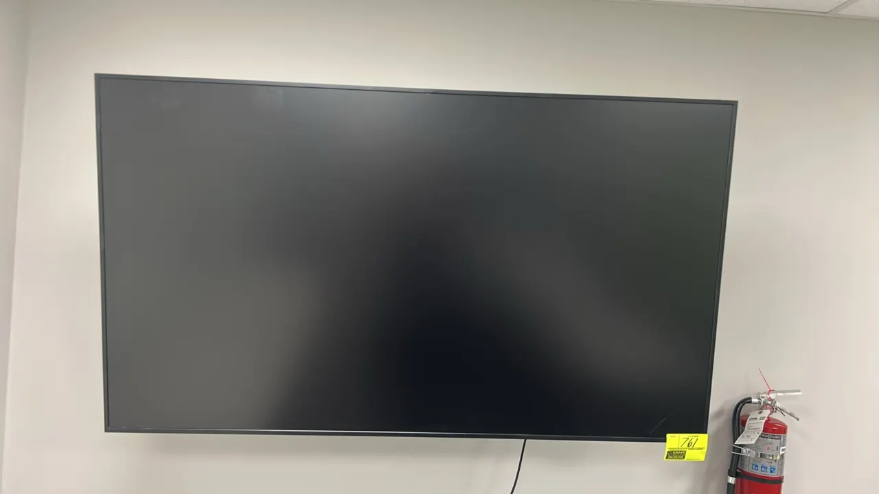 2023 Samsung QM65B 65" flat panel display. S/N: 0DR8HCZW900047E. Electrical: 100-240V, 50/60 Hz, 1-Phase. Includes articulating wall mount bracket.