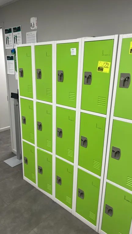 AdirOffice 3-compartment metal employee lockers. Features white metal frames, green louver-vented doors, built-in label holders, recessed handles with