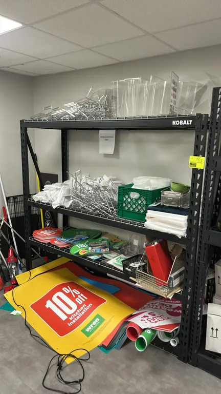 Kobalt 4-tier light-duty metal warehouse racking. Features black metal frame and wire mesh decking. 76" x 24" x 72". Contents not included.