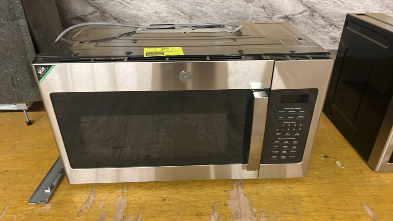 2021 GE Appliances JVM7195SK6SS over-the-range microwave oven. Features stainless steel finish, digital touch controls, and interior glass turntable.