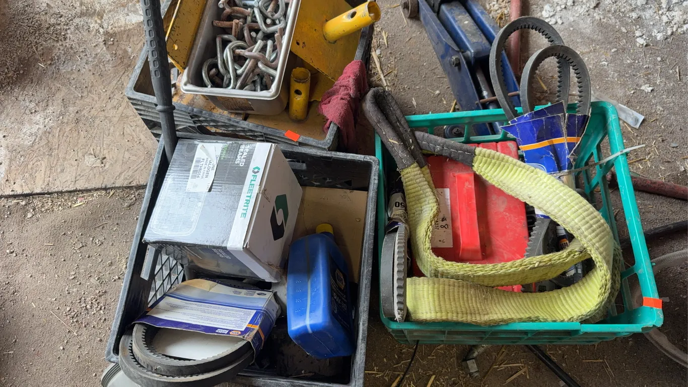 Crates with assorted belts straps and fluids