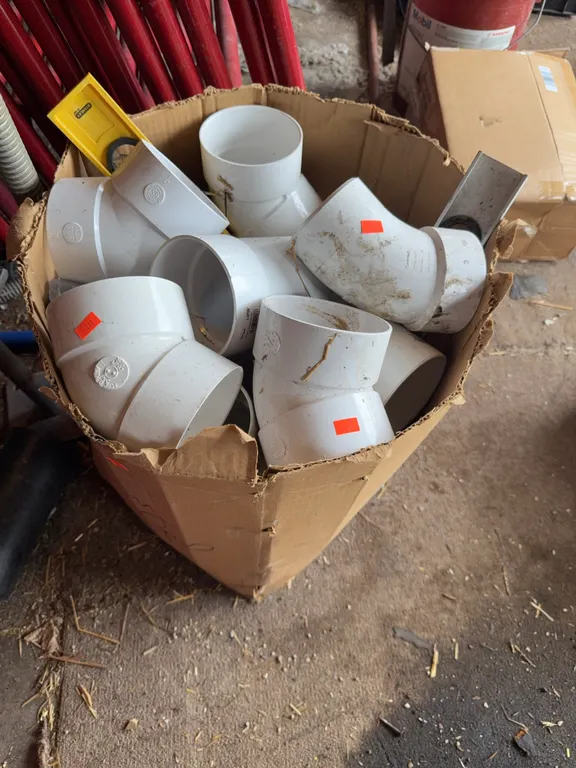 Box with Pipe Fittings Elbows and levels