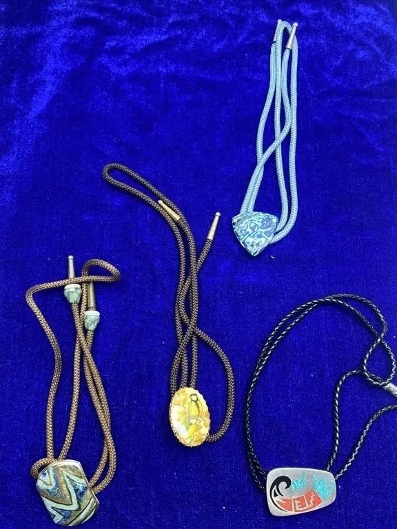 Four bolo ties with southwestern style slides