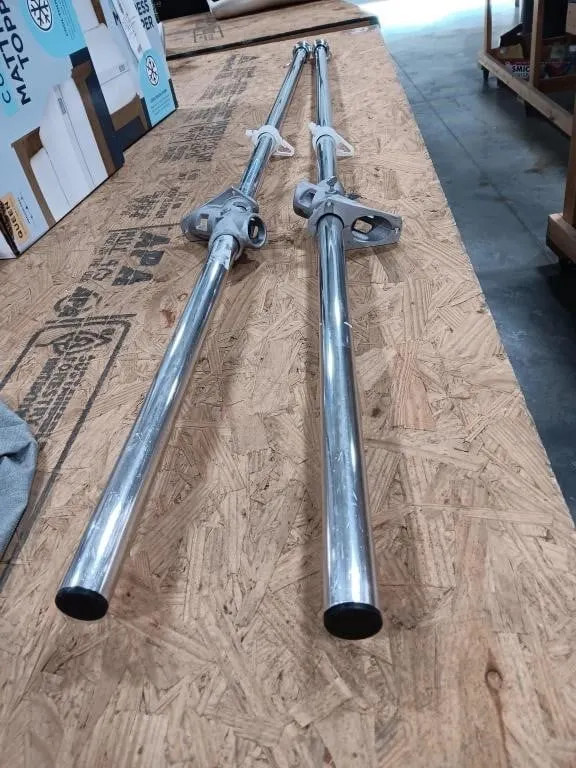 Two Aluminum Flag Poles With Brackets. Approx