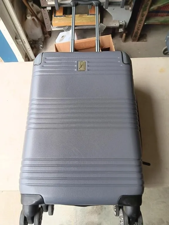 Travelpro rolling luggage. 20x15 in. Used. Stains