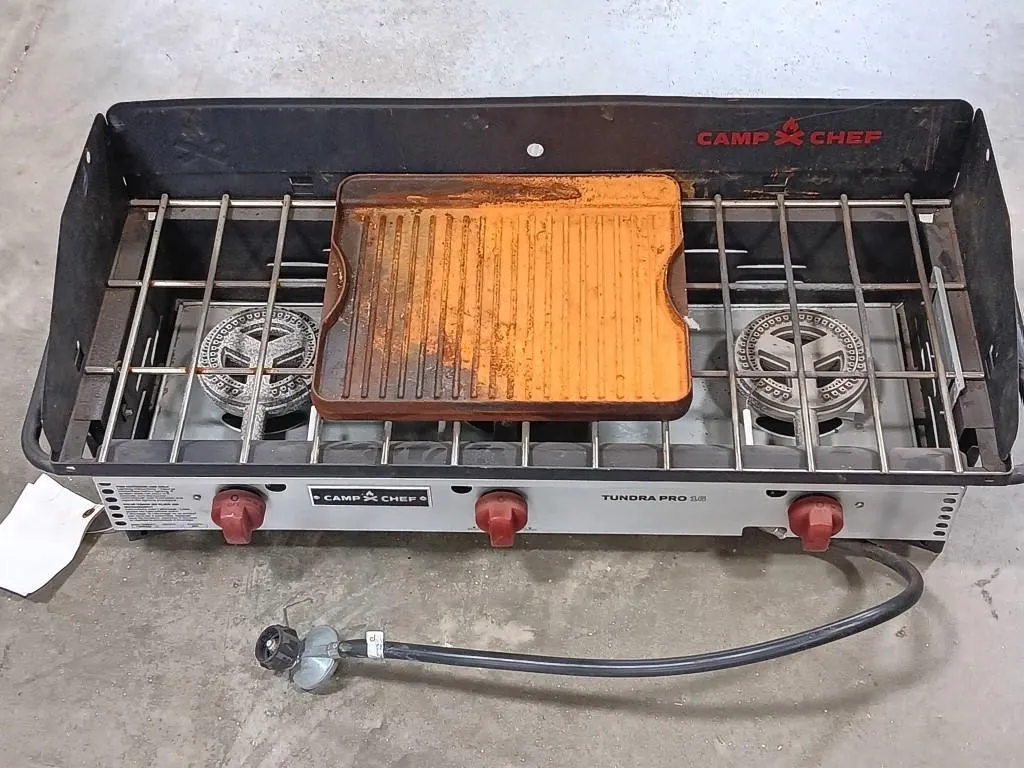 Camp Chef three burner grill. Uses propane, not