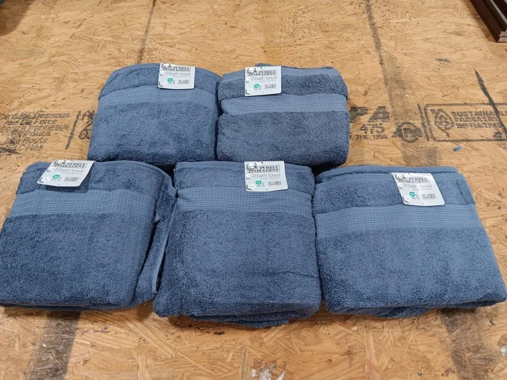 Five PURELY INDULGENT bath towels. Appear to be
