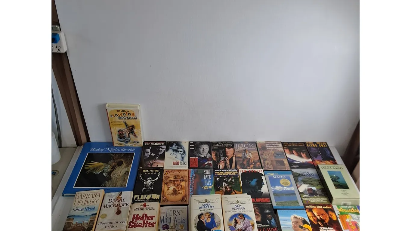 Large Assortment of VHS Movies & Paperback Novels - Mostly Romance