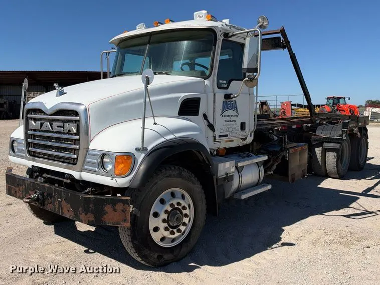 2003 Mack CV713 roll-off container truck
