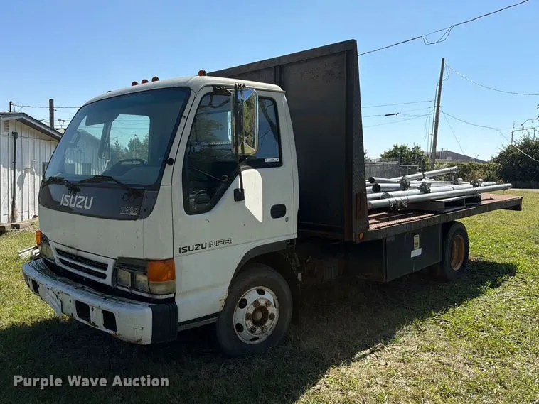 1999 Isuzu NPR flatbed truck