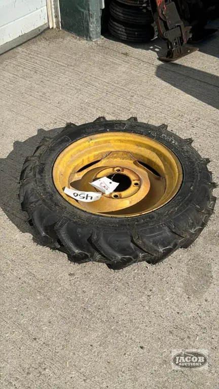 SPARE TIRE OFF A NH 166 HAY INVERTER ON 4 BOLT RIM