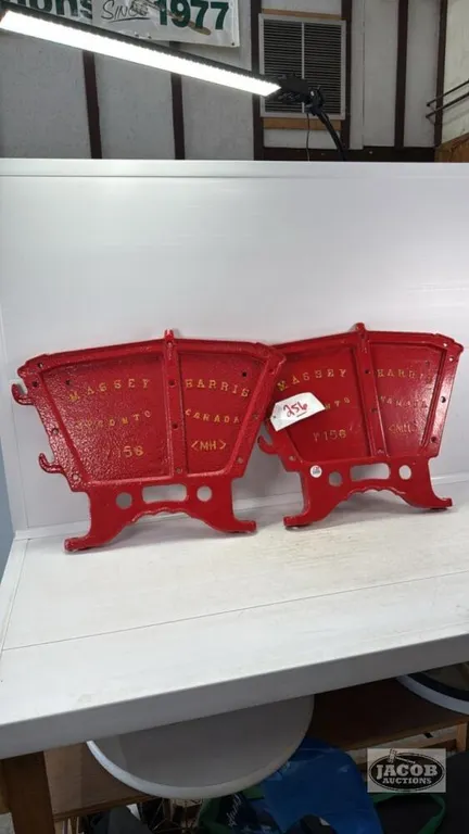 PAIR OF MASSEY HARRIS CAST DRILL ENDS