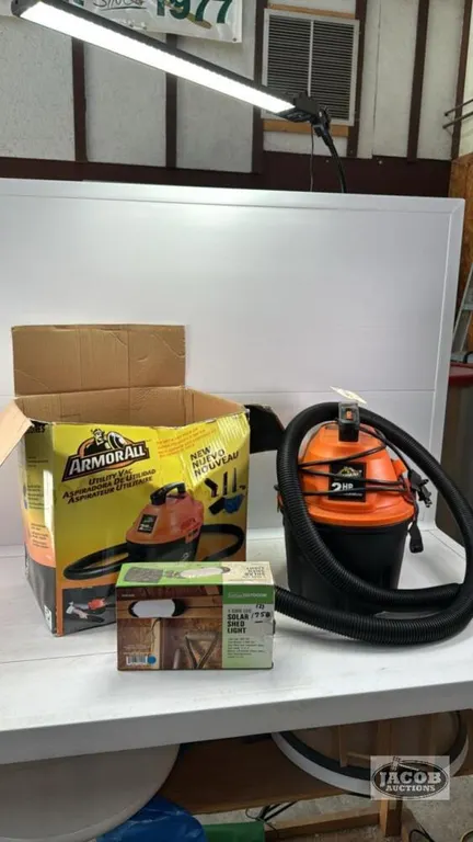 2HP. 2.5 GALLON SHOP VAC AND A SOLAR SHED LIGHT
