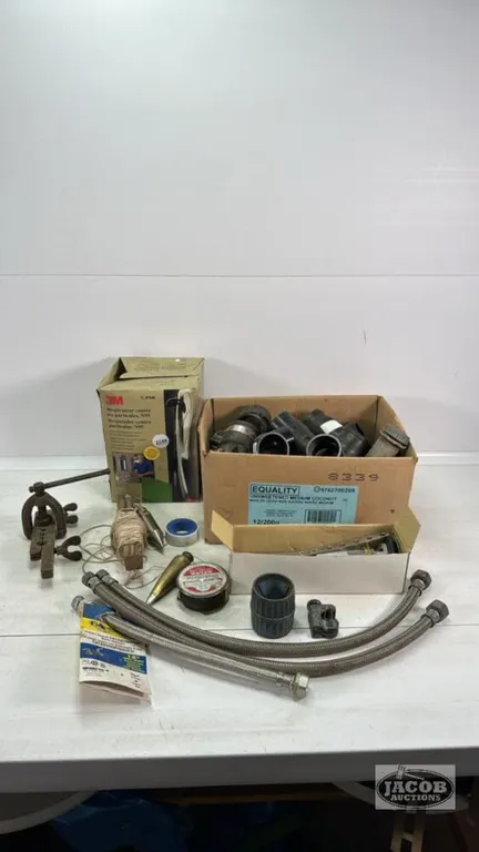 BOX OF N95 MASKS AND QUANTITY OF PLUMBING SUPPLIES