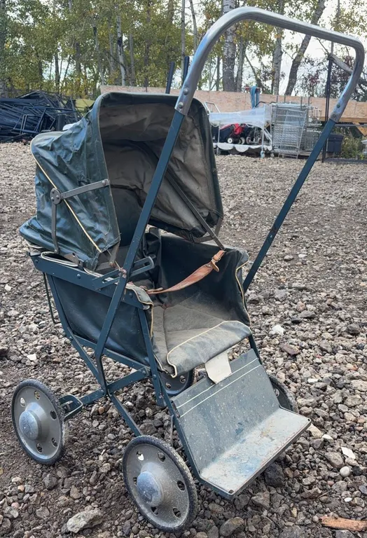 Early Metal and Canvas Baby Doll Stroller with Foldable Hood and Four Wheels