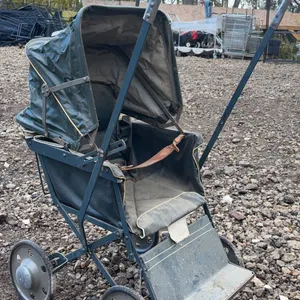 Early Metal and Canvas Baby Doll Stroller with Foldable Hood and Four Wheels