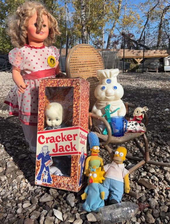 Dolls and Toys Including Pillsbury Doughboy, Simpsons, and Cracker Jack Doll