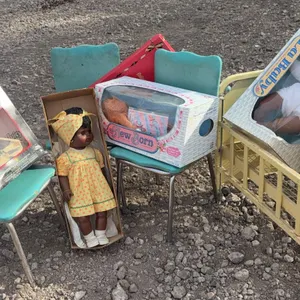Dolls With Boxes, Metal Toy Crib and Three Blue Chrome Chairs