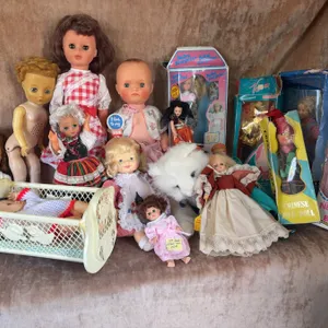 Vintage and Modern Dolls Including Baby Surprise, Barbie, and NKOTB