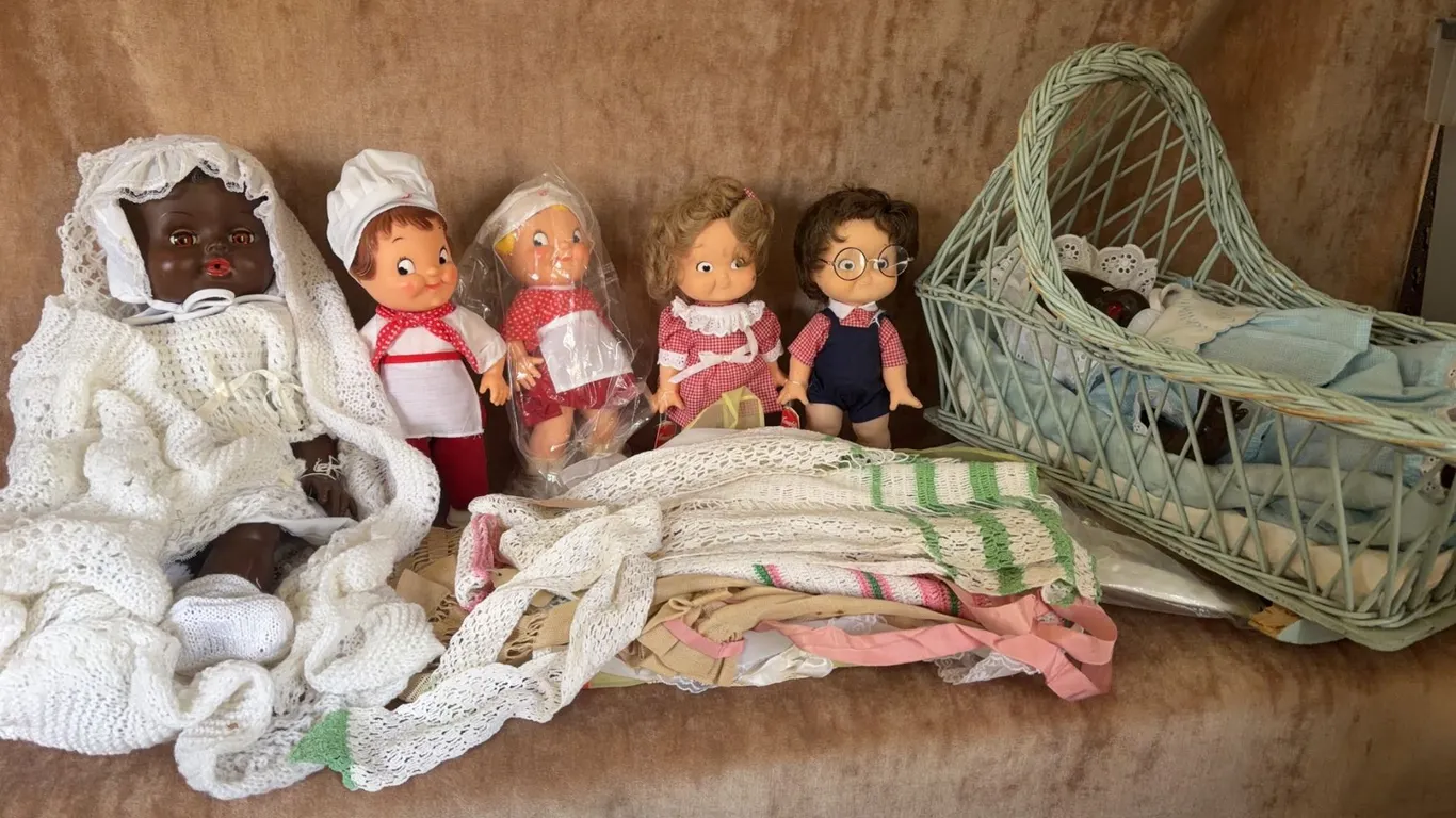 6 Dolls Including African American Baby Dolls, Wicker Basket, and Handmade Linens