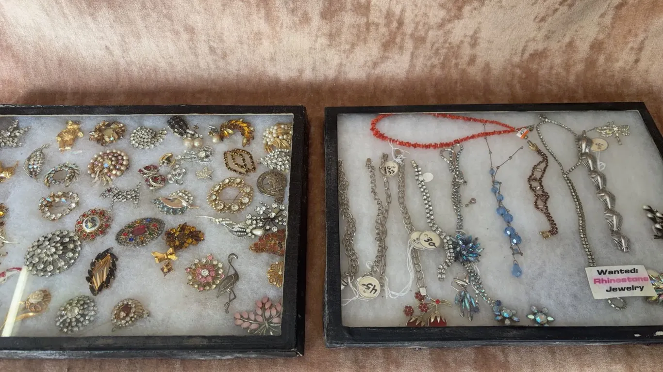 Rhinestone Brooches and Costume Jewelry with Bracelets and Necklaces in Display Cases