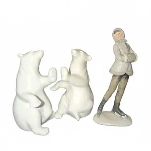 Two White Polar Bear Figurines and Female Ice Skater Figurine Group