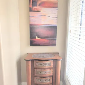 Small Wood Chest of Drawers with Carved Details and Abstract Wall Art