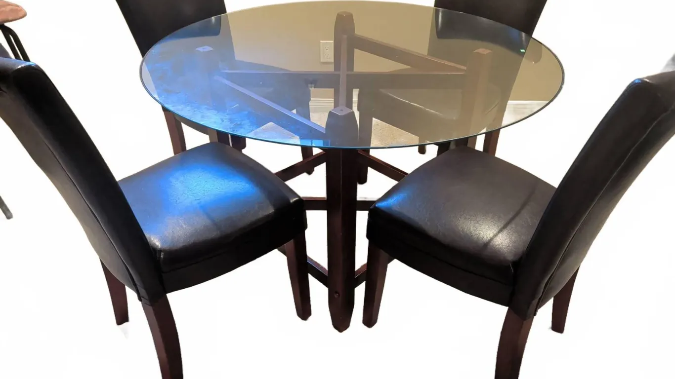 Round Glass Top Dining Table with Four Faux Leather Upholstered Chairs