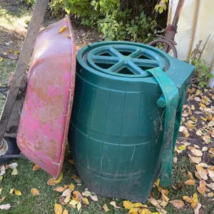 Old Metal Wheelbarrow and Plastic Compost Bin