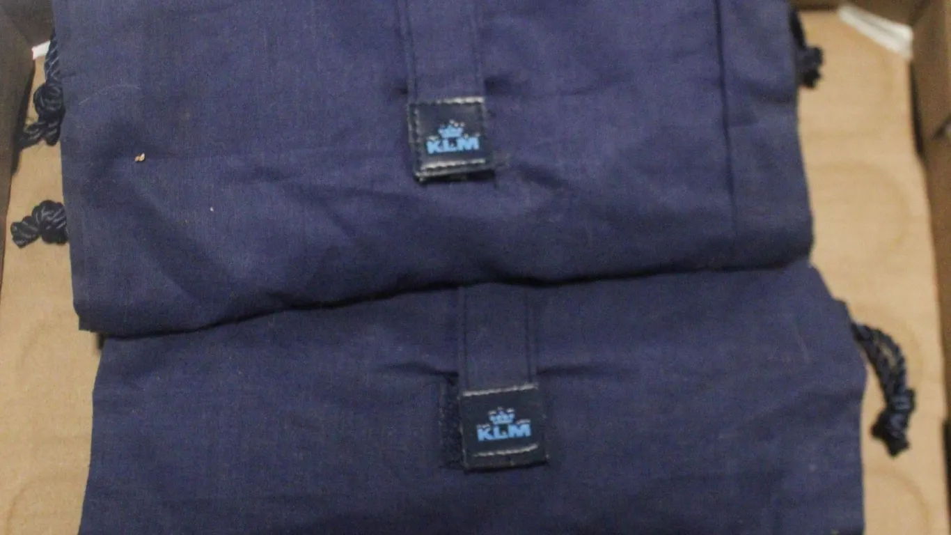 2 COMPLEMENTARY FIRST CLASS BAGS